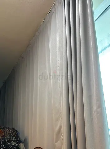 Floor-to-ceiling grey curtains with sheer lining. one piece 7 meter long 328 cm height