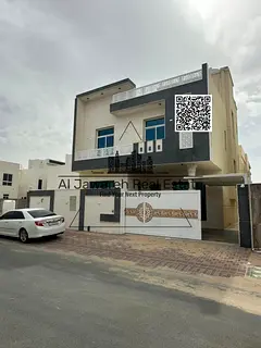 Villa with 6 bedrooms, 2 living rooms, maid's room, and parking. Prime location in Al Yasmin.