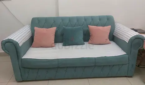 Stylish Pink Ottoman with Tufted Design