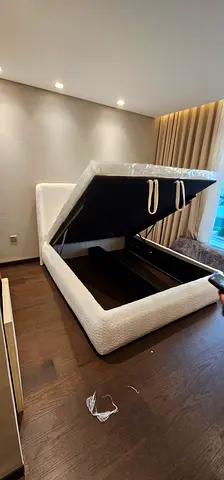 My cream upholstered storage double bed frame with lift-up base
