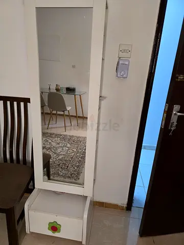 White full-length dressing mirror with bottom storage