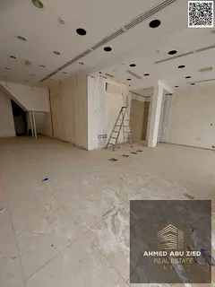 Annual rent: large shop with mezzanine (900 sq ft), private bathroom, ready finishes, strategic prim