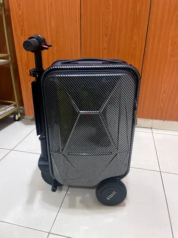Black hard-shell carry-on roller luggage
