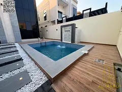 A stunning villa with a swimming pool, comprising 5 master bedrooms with built-in wardrobes and a ro