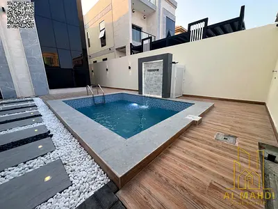 A stunning villa with a swimming pool, comprising 5 master bedrooms with built-in wardrobes and a rooftop terrace, is now for sale in a prestigious ar