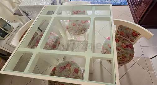 Elegant Glass Dining Table with Floral Chairs