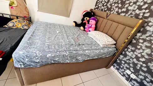 Upholstered bed with padded headboard - good condition with storage. No mattress