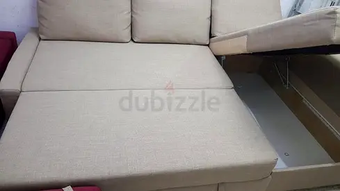 Beige sofa bed with built-in storage (used)
