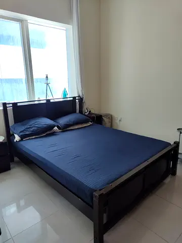 Double bed frame without mattress (used) — dark finish