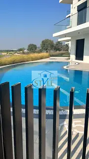 Two bedrooms and a spacious living room for sale with a view of the golf course in Al Zorah, Ajman