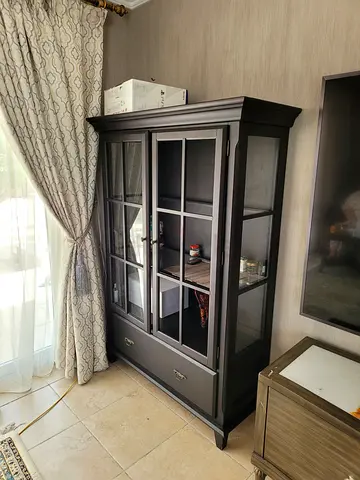 Dark wood glass display cabinet with drawers missing glass panel