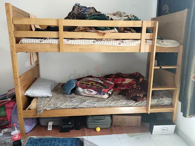 Wooden bunk bed with one mattress for sale al muroor