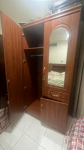 Used brown wooden wardrobe with mirror and drawers