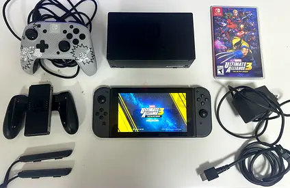 Nintendo switch including cables, charging dock, two controller, joy sticks, marvel alliance 3