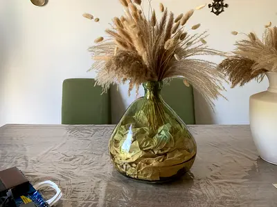 Large green glass vase with dried pampas grass - decorative centerpiece
