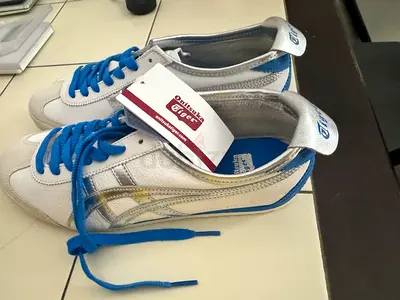 Brand New White Onitsuka’s Tiger Sneakers with Blue Laces