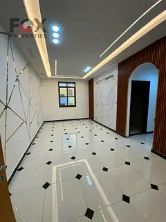 A two-room apartment and a living room for annual rent in Al Rawda 3 - Ajman. The apartment features