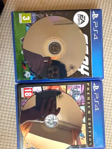 PS4 games - FIFA 24 and Grand Theft Auto V (discs + cases)