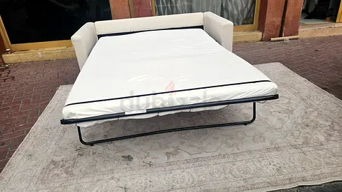 Beige pull out sofa bed with mattress
