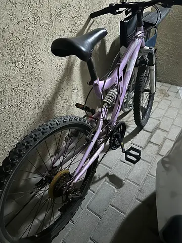 Light purple full-suspension mountain bike (used)