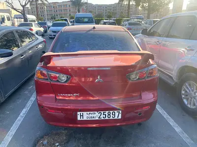 Mitsubishi Lancer 2015 – 15,000 AED Negotiable | Good Condition | Company Logo Wrap (Removable)