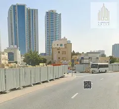 Corner plot for sale in Liwara 2, Ajman. Prime location opposite the school station, with the possib