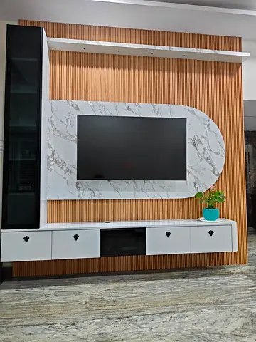 Modern wall-mounted entertainment center with marble-look TV panel