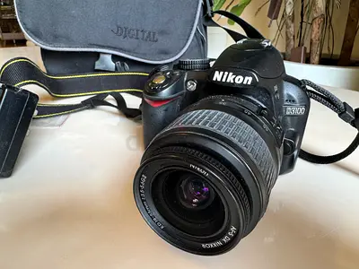 My Nikon D3100 DSLR + 18-55mm kit lens and bag (perfect condition)