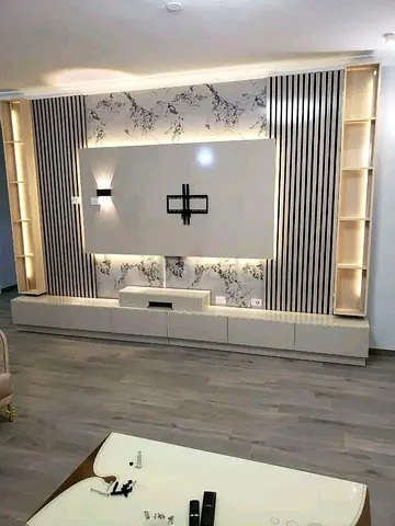 modern built-in entertainment center with storage and LED lighting