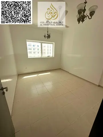For annual rent in Ajman - Directly on Al Ittihad Street - Two-bedroom apartment with a living room and two bathrooms - Price: 37,000 AED - Flexible p