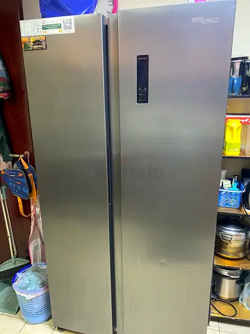 Stainless steel double-door refrigerator (side-by-side) — good working condition