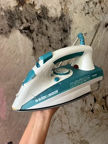 Blue-green/white iron from black  decker 20 AED 💰