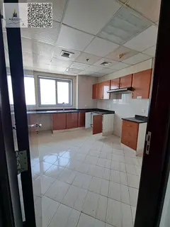 Two bedrooms and a living room for sale in Corniche Tower with a sea view in a prime location with a