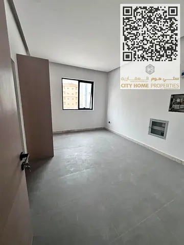Studio for annual rent in Al Nakheel 1, Ajman with a practical layout and brand-new finishing (first tenant). Split AC + separate kitchen + prime lo