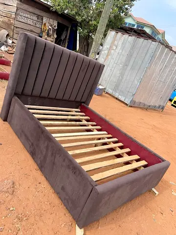 Upholstered bed frame with padded headboard