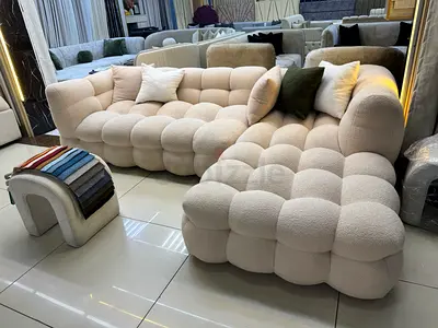 Customized L-shaped tufted bouclé sofa with chaise