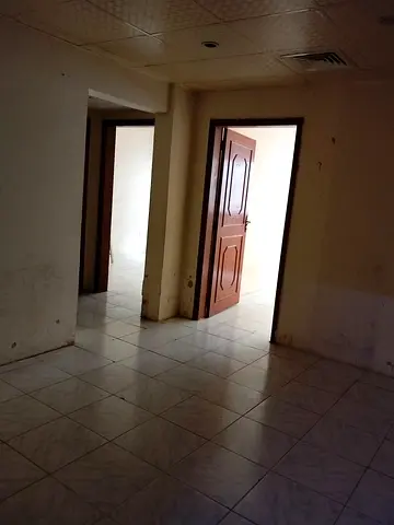 A 2-bedroom apartment with a living room is available for annual rent in Al Butina, Sharjah, located in a lively area close to all essential services