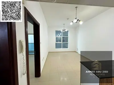 Luxury 1BR in City Tower, 2 baths, balcony, AED 28K, excellent finish, prime location, easy access to Dubai & Sharjah, central AC, vibrant area.