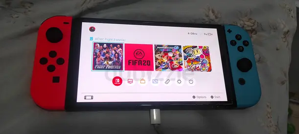 Nintendo Switch (Neon Red/Blue) console with Joy‑Cons — good working condition light usage also