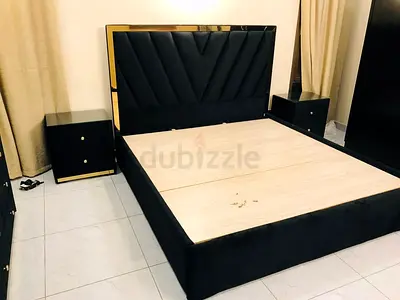 Queen size black upholstered bed frame with headboard and 2 bedside tables