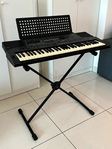 Portable electronic keyboard with X-stand and music rack - good condition