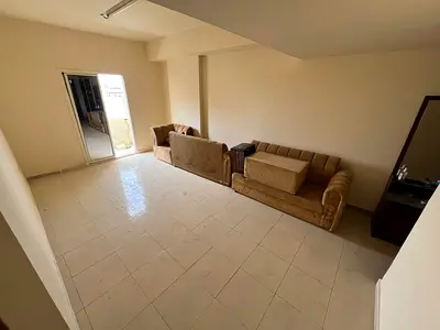 One-bedroom apartment with a living room - Al Rawda 1, Ajman - Family accommodation - Central air conditioning - Free maintenance
