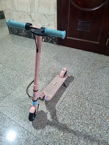 Ninebot Lightweight Pink Kick Scooter with Blue Grips — Good Condition