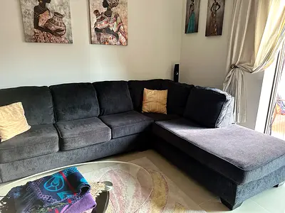 Dark blue L-shaped sectional sofa bed with chaise (excellent condition)