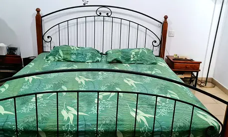 Solid wood king size bed from Homes r us, medical mattress, 2 sidetables as new for sale