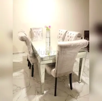 Mirrored glass dining table with 6 upholstered chairs — excellent condition