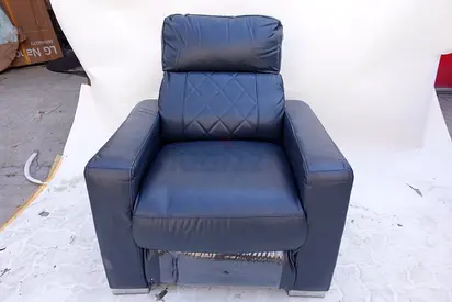 (43) A Modern, Plush Armchair Upholstered in a Deep High-Quality Navy Blue Faux Leather.