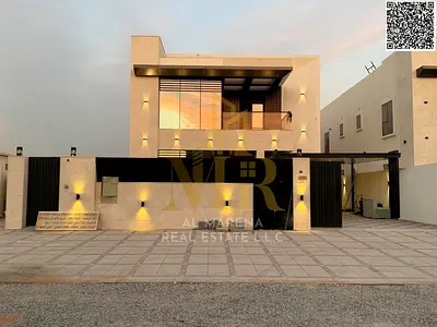 Luxury villa in Al Muwaihat 2, modern design with a yard, outdoor seating area, and central air conditioning.