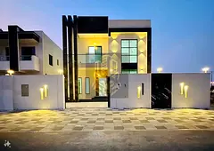 A luxurious villa with an elegant design featuring 4 master bedrooms a living room a majlis formal s