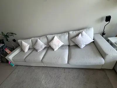 Ikea 4 seat sofa with a bed section and a footstool